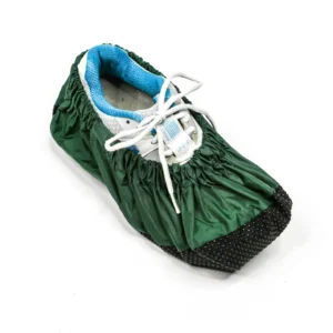 A green shoe cover covering a shoe
